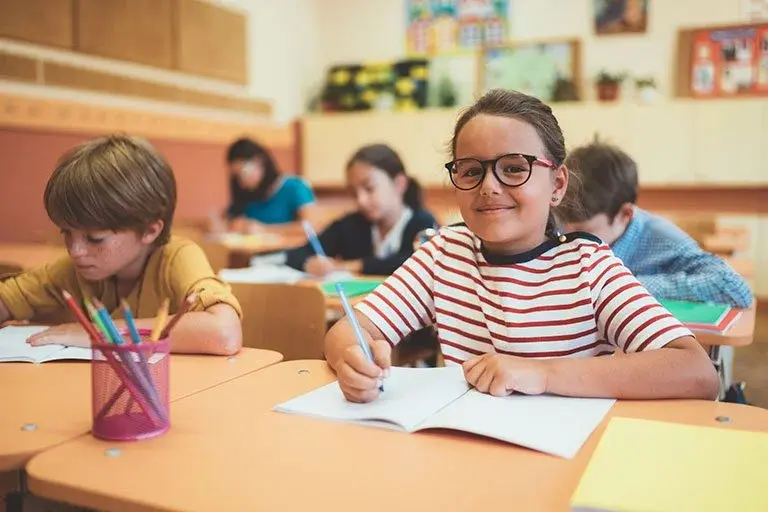 Girl_doing_math_in_classroom