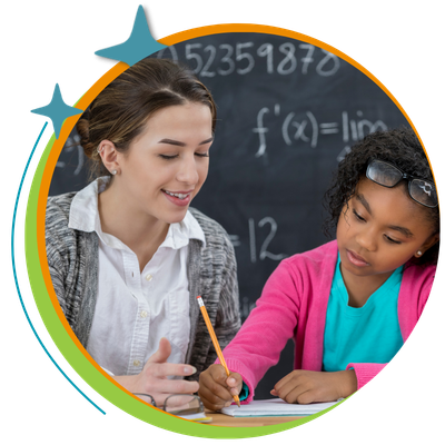 Teacher working with student on math.