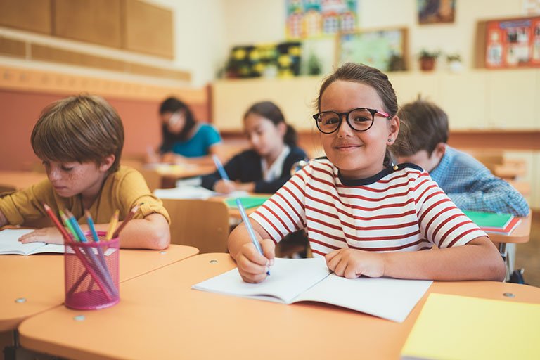 Girl_doing_math_in_classroom